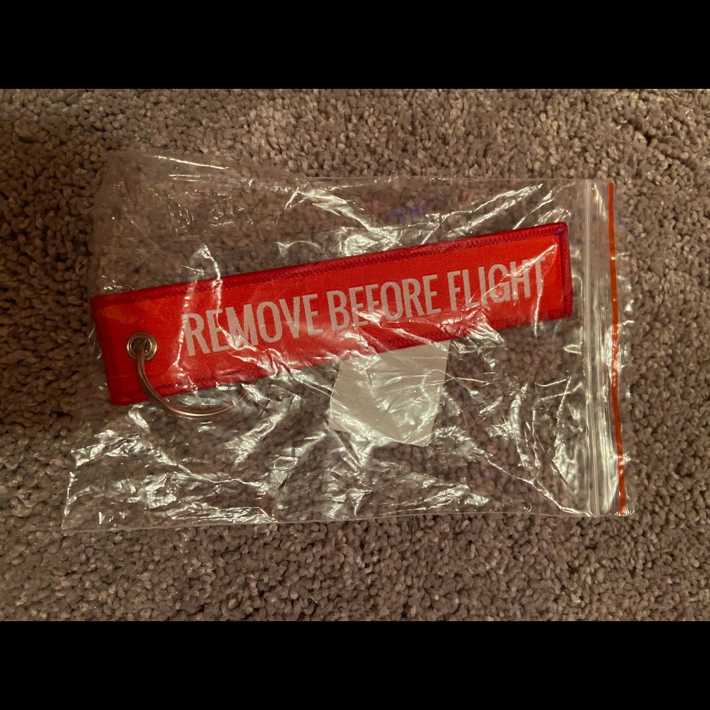 Remove before flight keychain